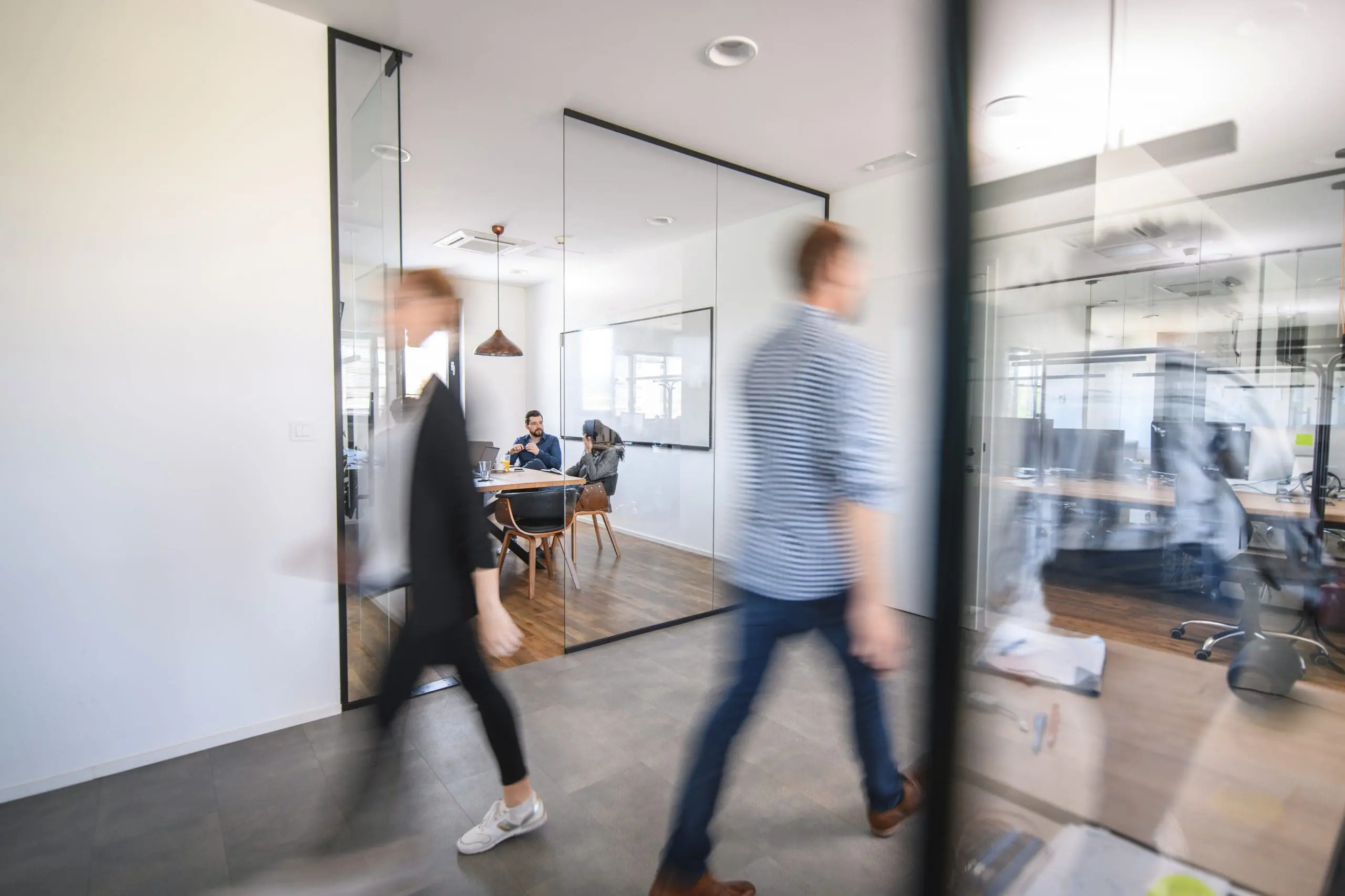 Office workers navigate a workspace