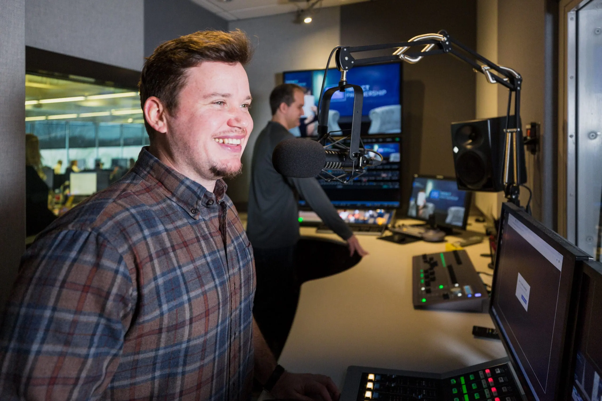 Impact TV producer working in the TV studio