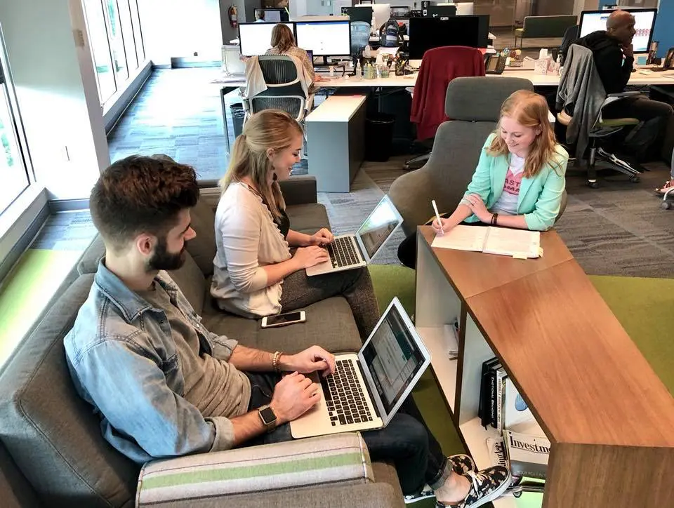 A team of Impact's copywriters brainstorms to create brand names and taglines for financial advisors.