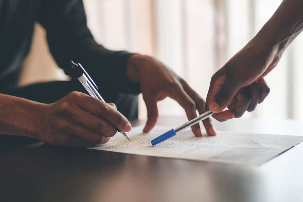 Financial advisor explaining documents with partner